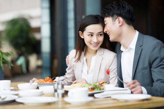 Couple talking at dinner